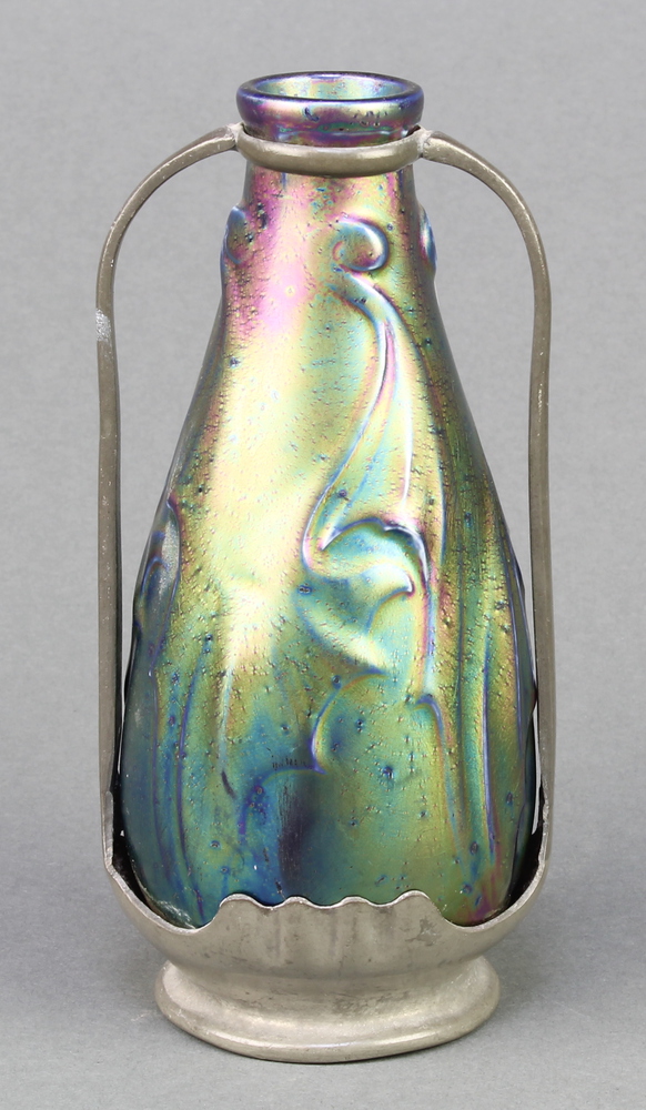 An Art Nouveau iridescent bottle vase contained within a pewter mount with twin handles 6" The