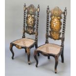 A pair of Victorian black lacquered and inlaid mother of pearl slat back nursing chairs with