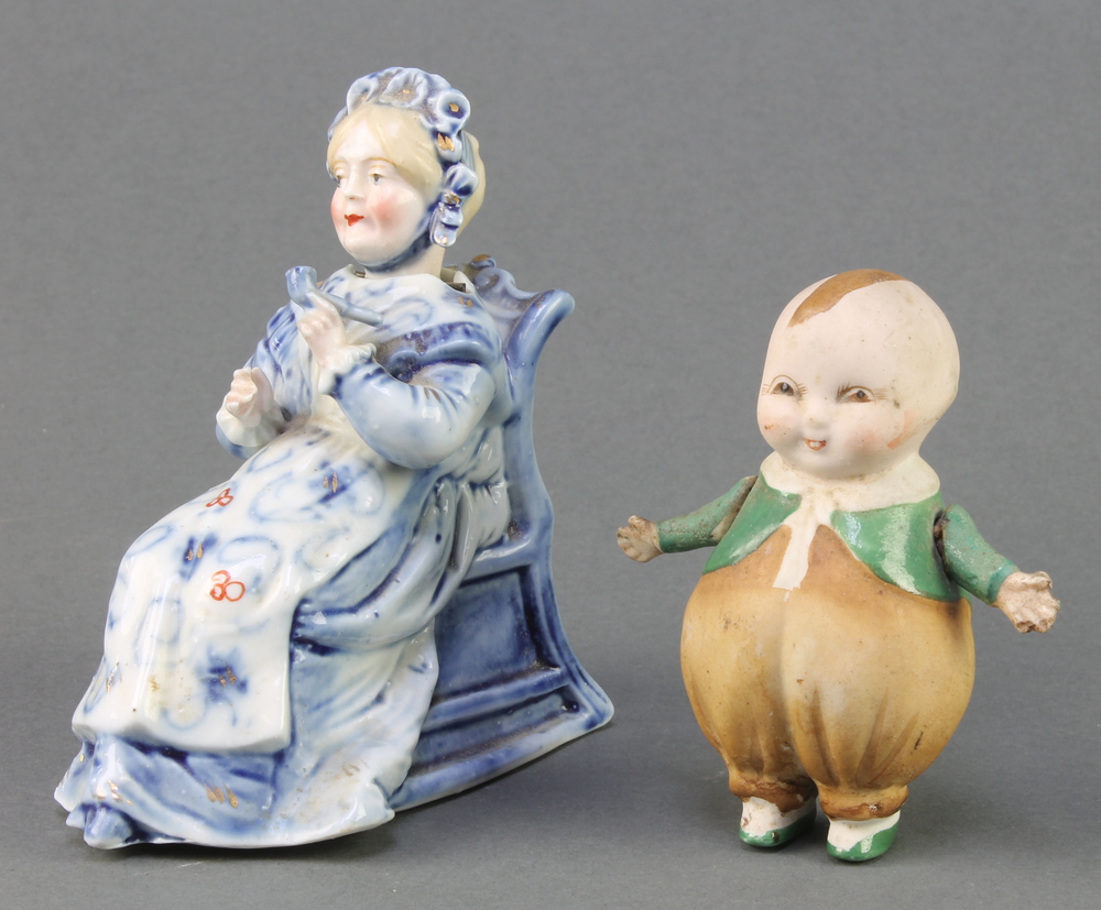 A 19th Century German porcelain figure of a lady sitting in a chair with nodding head 4", a ditto