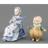 A 19th Century German porcelain figure of a lady sitting in a chair with nodding head 4", a ditto