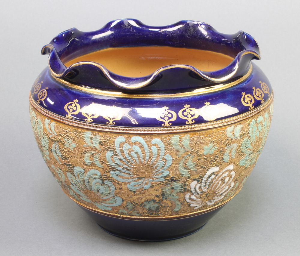 A Royal Doulton jardiniere, the blue ground with a band of stylised flowers 7 1/2"