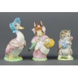 3 Beswick Beatrix Potter figures - Mrs Rabbit 1200 4 1/4", Jemima Puddleduck 1092 4 3/4" and Miss