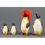 A Beswick figure Penguin with umbrella 802 4 1/2", a ditto holding an umbrella 803 4", 2 smaller