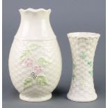 A Belleek waisted basket shaped vase with clover decoration 5 1/2" having black mark, a baluster