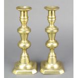 A pair of 19th Century brass candlesticks 10"