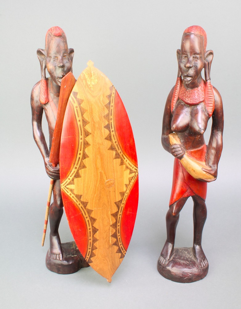 A pair of African painted figures of a lady and gentleman 19"