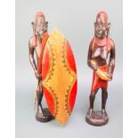 A pair of African painted figures of a lady and gentleman 19"