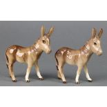 A Beswick figure Donkey foal 2110, gloss, 4 1/2" and a ditto
