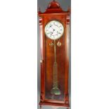 A Vienna style striking regulator with 7" enamelled dial, Roman numerals, grid iron pendulum