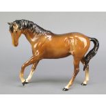 A Beswick figure of a brown horse 10"