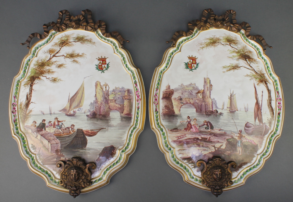 A pair of 19th century Continental painted porcelain plaques depicting figures in coastal towns,