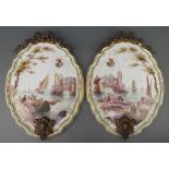 A pair of 19th century Continental painted porcelain plaques depicting figures in coastal towns,