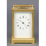 A 19th Century French 8 day striking carriage clock with enamelled dial and Roman numerals,