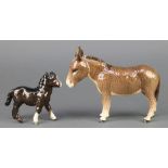 A Beswick figure Donkey, brown gloss, 2267A 5 1/2" and a ditto foal with right turned head, black