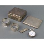 A silver engine turned cigarette case, 2 napkin rings, a cigarette box and pocket watch, weighable