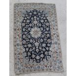 A Persian blue and white ground Nain rug with central medallion and floral ground 53" x 30", some
