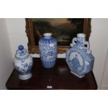 Three blue and white vases.