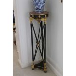 A PAIR OF TALL CIRCULAR TORCHERE STANDS,