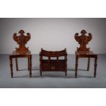 A PAIR OF MAHOGANY HALL CHAIRS, MID 19th