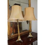 A pair of gilt table lamps.