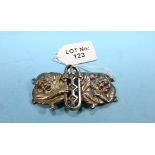 A LATE VICTORIAN EASTERN WHITE METAL WAIST BUCKLE cast with figures, import mark for Birmingham