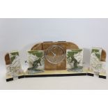 A 20TH CENTURY ART DECO COLOURED MARBLE CLOCK GARNITURE , the circular clock with chrome button