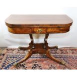 AN EARLY 19TH CENTURY REGENCY PERIOD MAHOGANY AND CUT-BRASS INLAID "D" SHAPED CARD TABLE, the