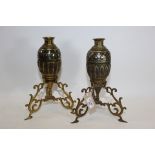 A PAIR OF 19TH CENTURY MIDDLE EASTERN INLAID BRASS AND COCONUT SHELL HOOKAH BASES on foliate