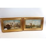 A PAIR OF LATE 19TH CENTURY OILS ON PANEL depicting a wintry country town and a riverside