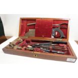 A 19TH CENTURY FIELD SURGEONS SET in original fitted mahogany box, ebony handled equipment including