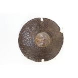 AN AFRICAN "BEJA" CIRCULAR ANIMAL HIDE SUDANESE WAR SHIELD, 19 1/2 ins diameter.