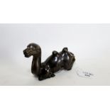 A 17TH/18TH CENTURY CHINESE BRONZE SCROLL WEIGHT modelled as a recumbent bactrian camel, 5 1/2 ins