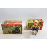 A 20TH CENTURY GERMAN "SCHUCO" WALT DISNEY CLOCKWORK PORKY PIG DRUMMER, 4 1/4 ins high (box lacks