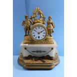 A LATE 19TH CENTURY FRENCH GILT METAL AND ALABASTER MANTLE CLOCK, circular white enamel dial in a