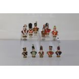 ELEVEN PORCELAIN RUDOLF KAMMER VOLKSTEDT PORCELAIN BUSTS DEPICTING FIGURES IN MILITARY DRESS