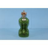 A LATE VICTORIAN GREEN GLASS KUTTROLF DECANTER with silver collar and four spouts, matching silver