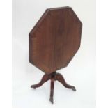Octagonal tilt top occasional table  CONDITION: Please Note -  we do not make reference to the
