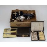 A box of assorted silver plated cutlery etc together with place mats,