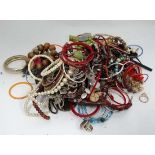 A very large quantity of assorted costume jewellery to include bracelets, necklaces etc.