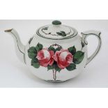 A Newport Pottery Company Ltd '' Roses '' pattern teapot, painted by J Hancock,