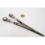 A pair of silver handled glove stretchers hallmarked Chester 1903 maker James Deakin & Sons.