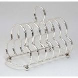 A six section silver plate toast rack with loop handle CONDITION: Please Note - we