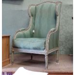 A French wing back armchair CONDITION: Please Note - we do not make reference to