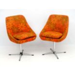 Vintage Retro : a pair of British 1970's swivel chairs with a four foot base and orange petal form