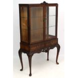 A mid - late 20thC burr walnut Chippendale style display cabinet on stand with 2 drawers 38" wide x