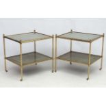 Mid Century / Hollywood Regency : A pair of gilt brass two tiered lamp tables with further gilt on