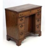 An 18thC mahogany kneehole desk 31 1/4" wide x 17 3/4" deep x 31" high CONDITION: