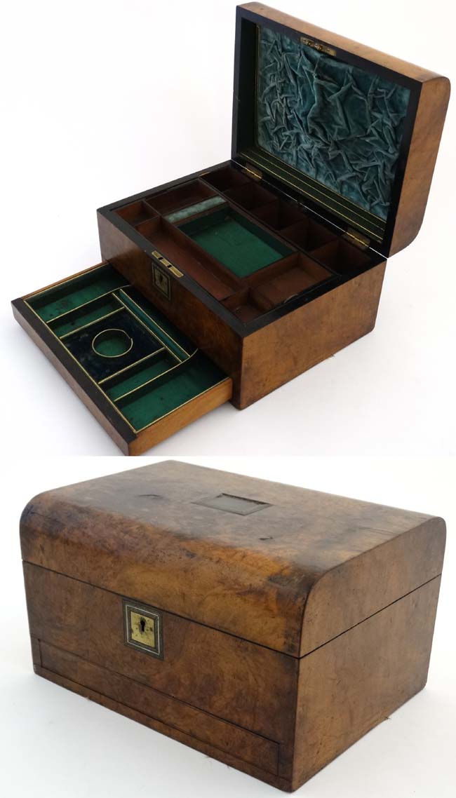 A 19thC semi-domed burr walnut ladies vanity box with scent bottle holders,