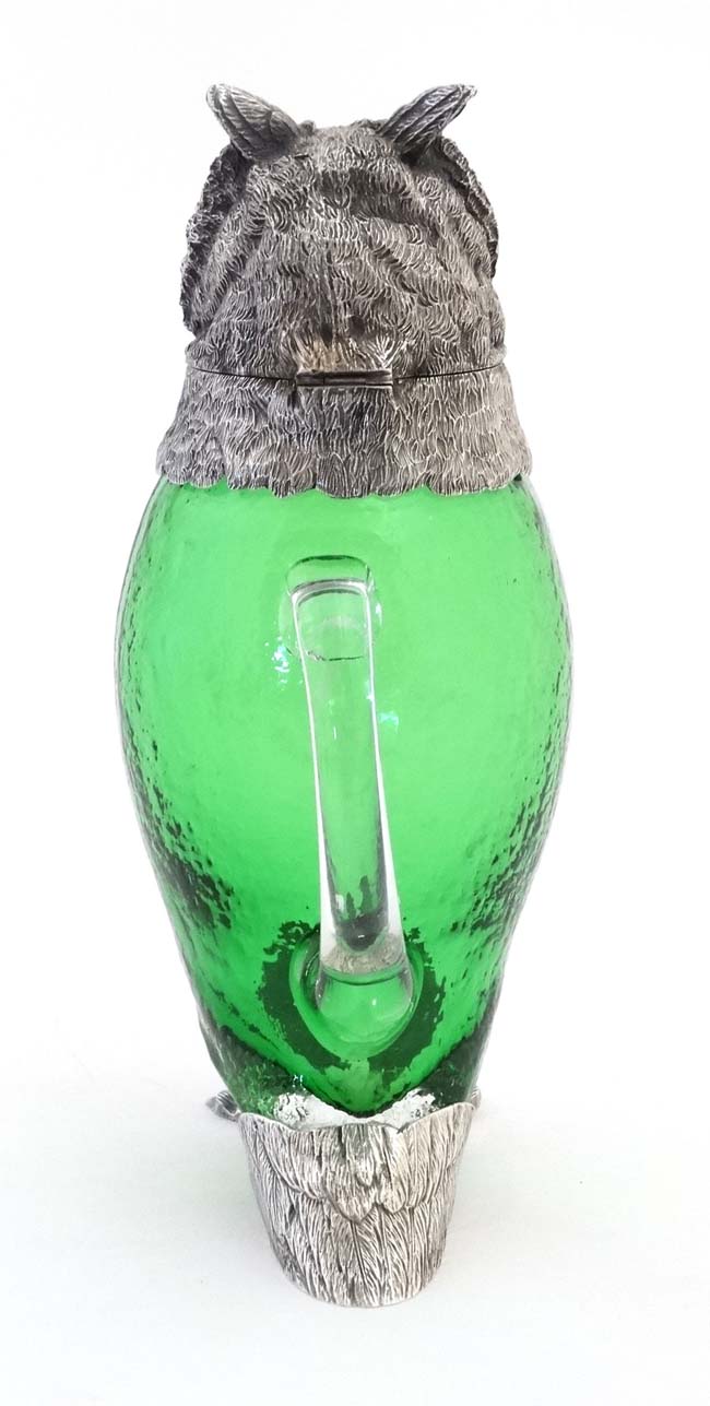 A late 20thC silver plate and green glass novelty claret jug in the form of an owl with glass eyes. - Image 6 of 7