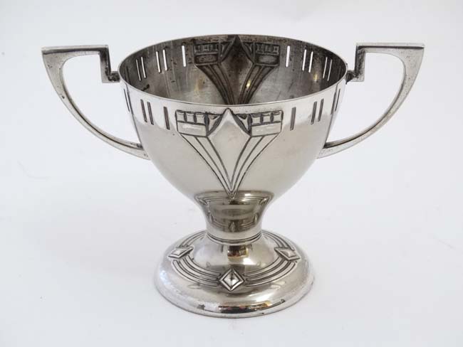 WMF : An Art Deco silver plate pedestal cup with two handles. marked under.